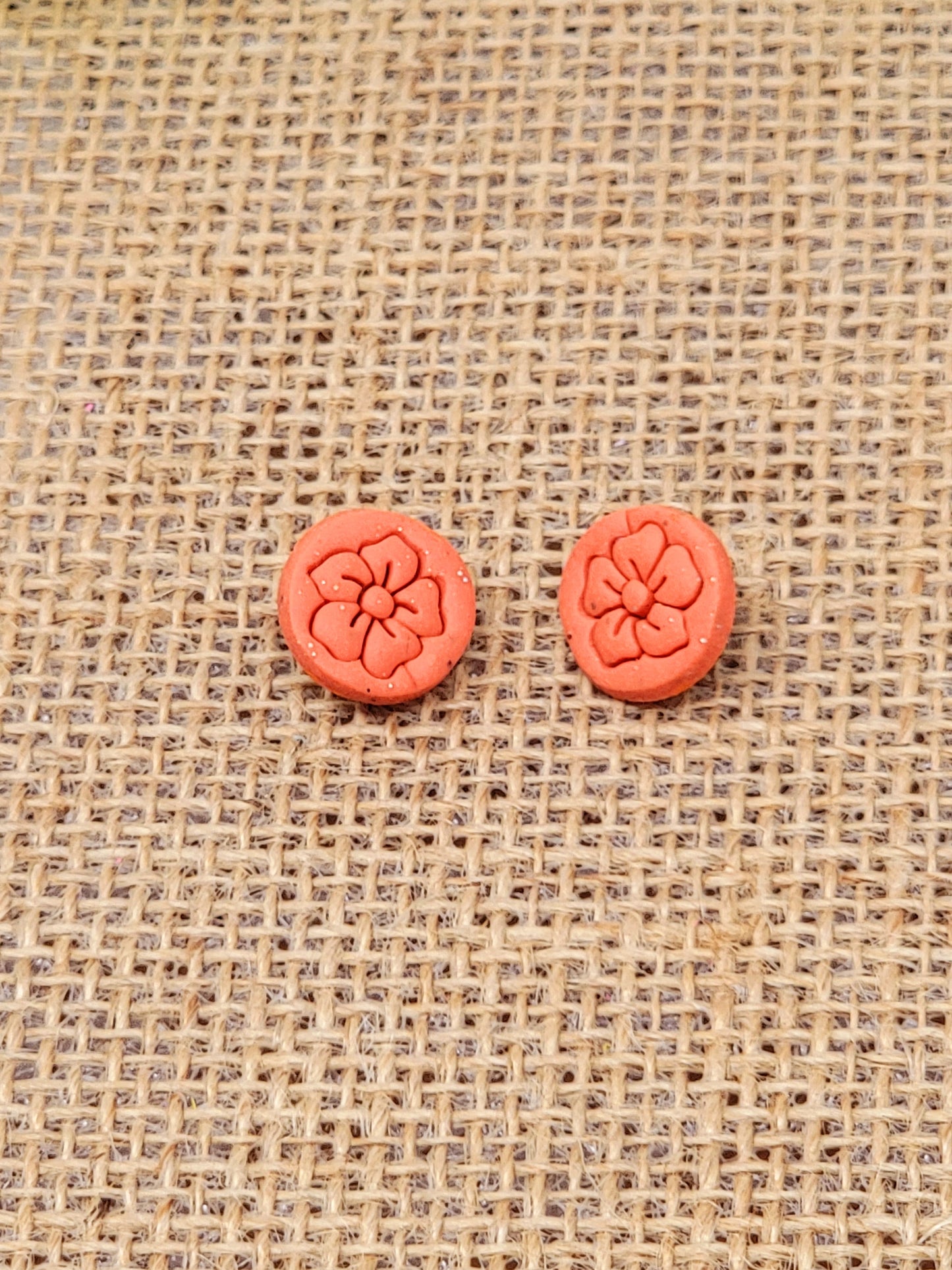 Orange floral stamp studs