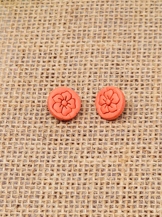 Orange floral stamp studs