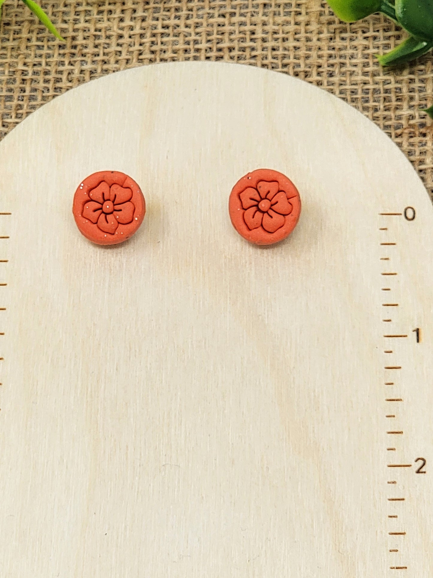 Orange floral stamp studs