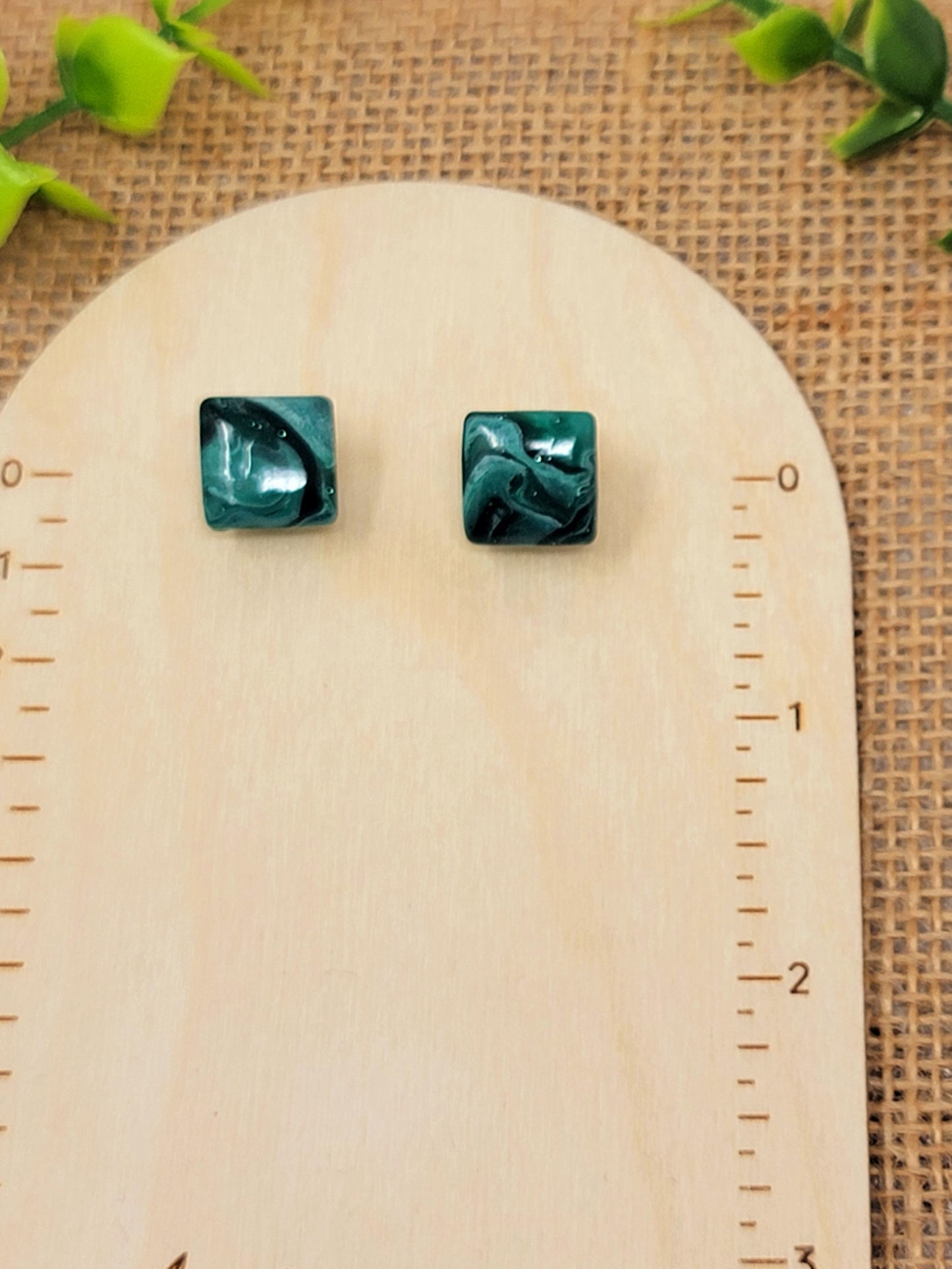 Dark green swirl studs