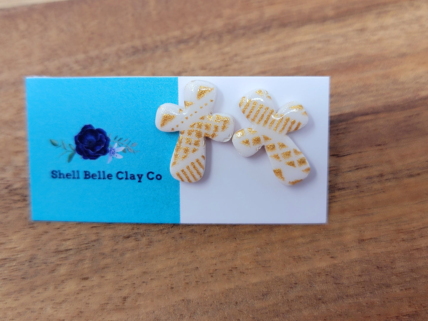 White & gold cross studs