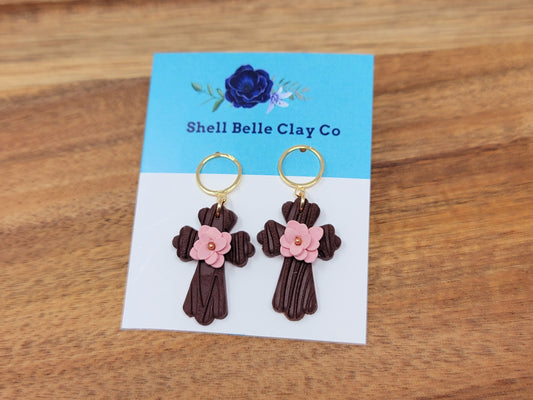 Wooden cross dangles with pink flower