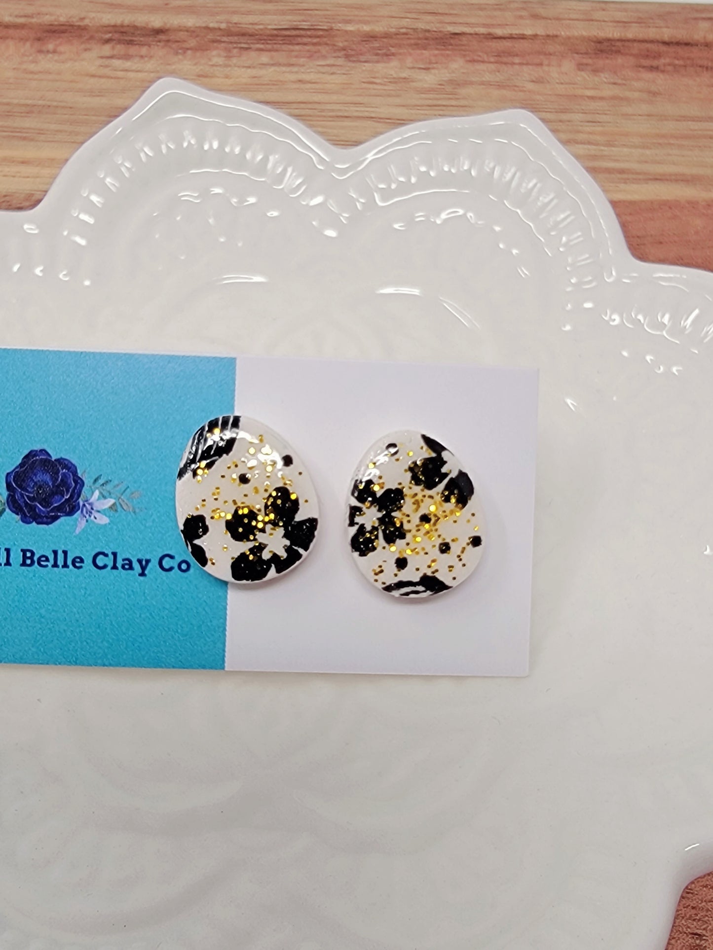Black & white floral easter egg studs with golden speckles