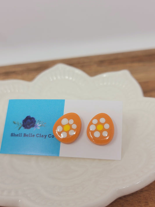 White flower orange easter egg studs