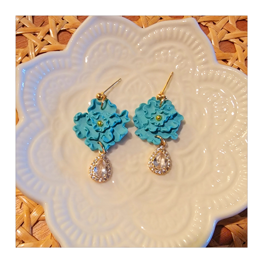 Light blue hand shaped flower dangles