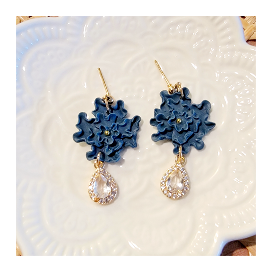 Dark blue hand shaped flower dangles