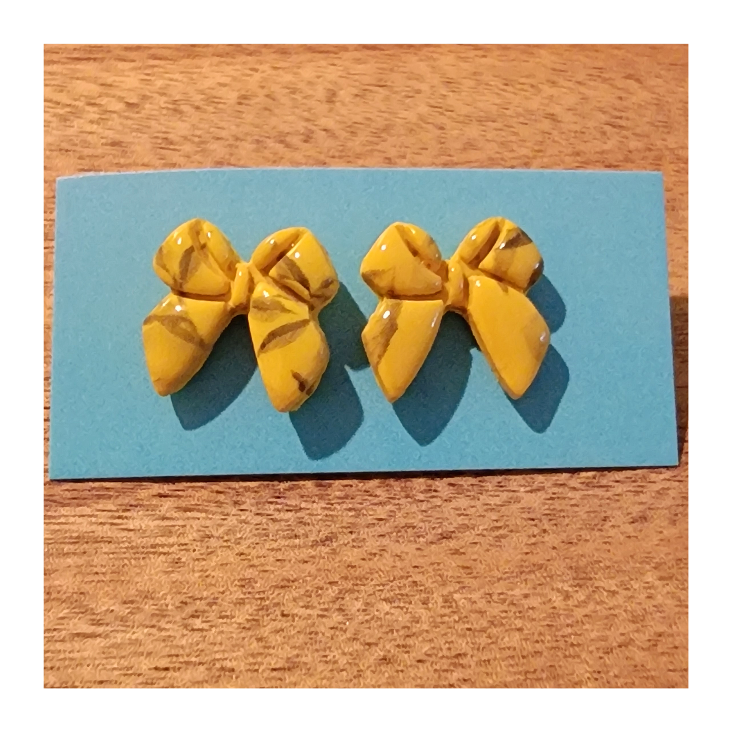 Yellow bow studs with lemon tree pattern