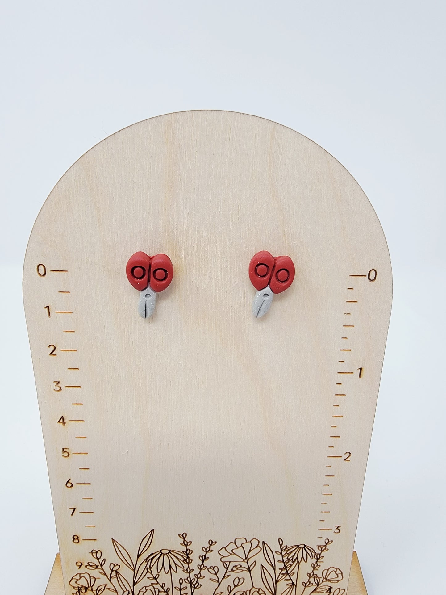 Red scissor studs