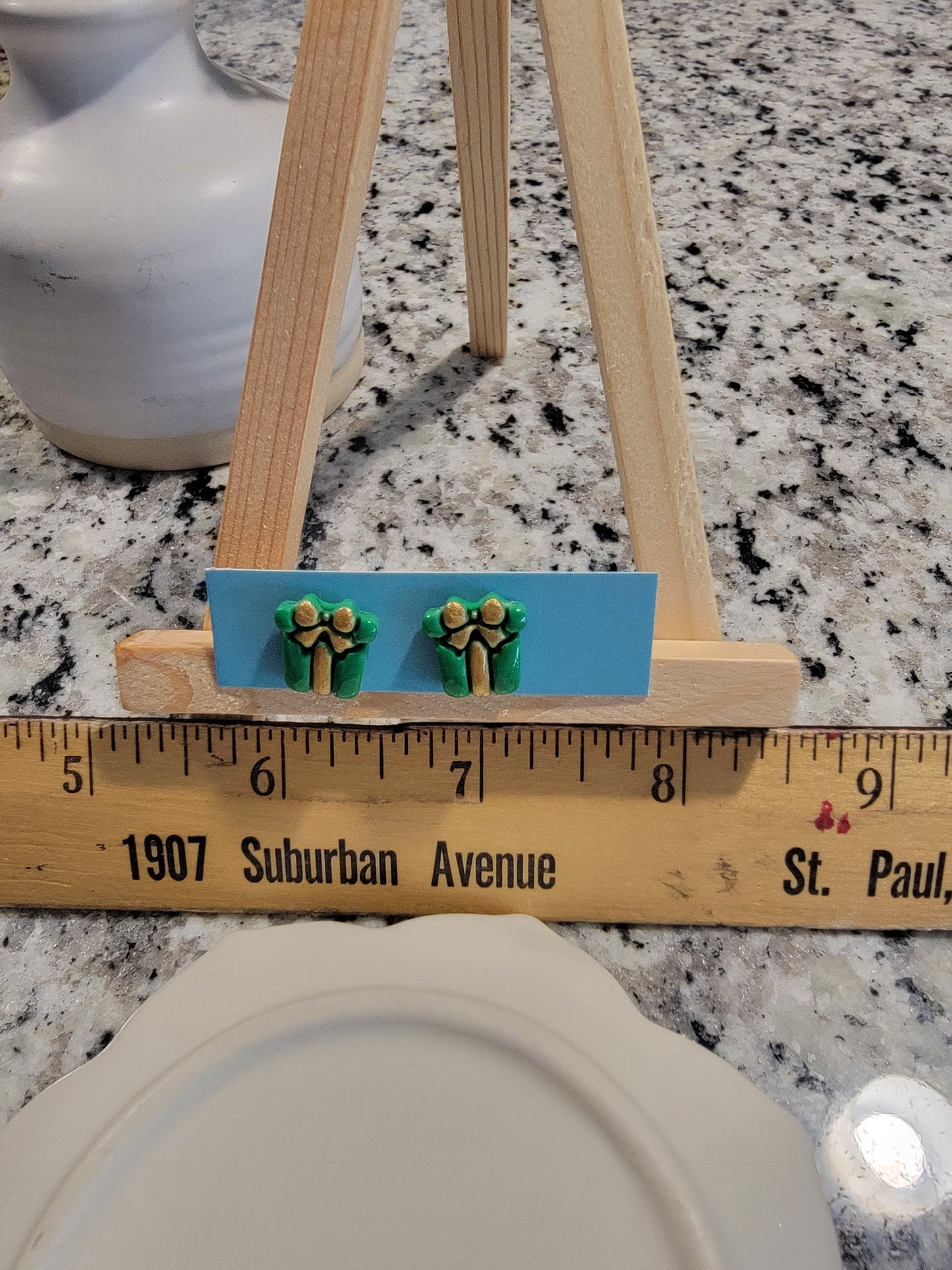 Green and gold painted present studs