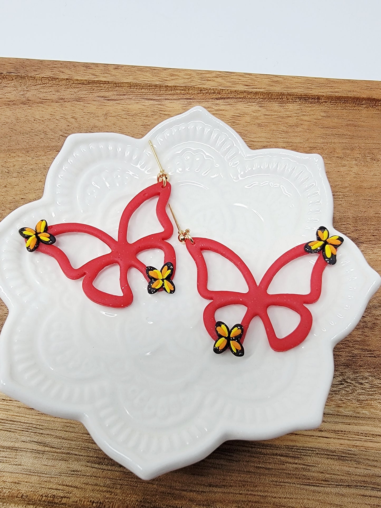 Red butterfly dangles