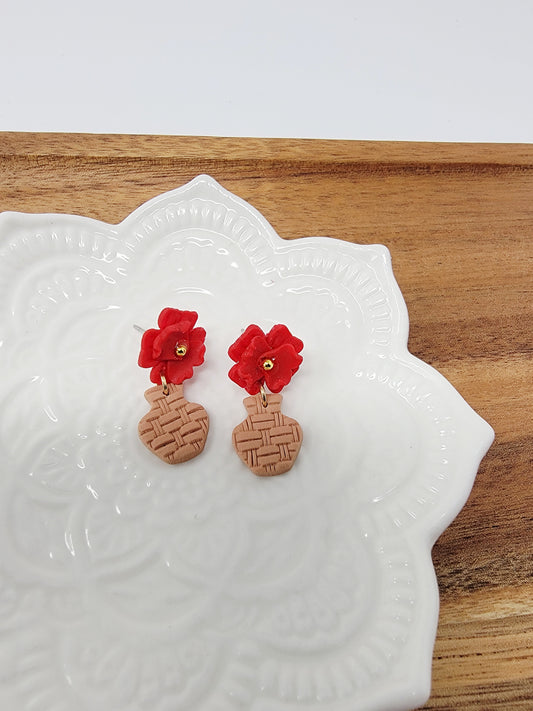 Red flower in vase dangles