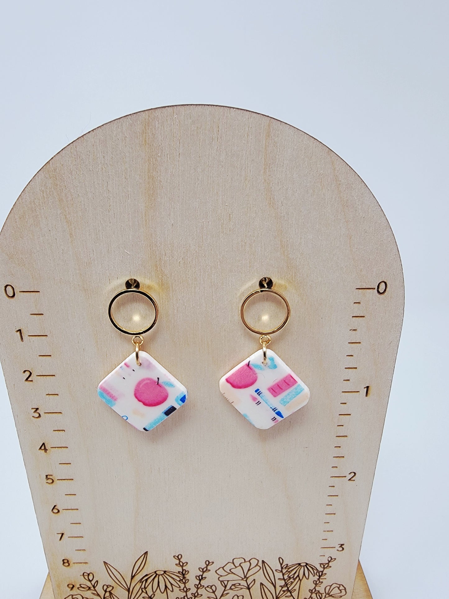 School dangles with gold top