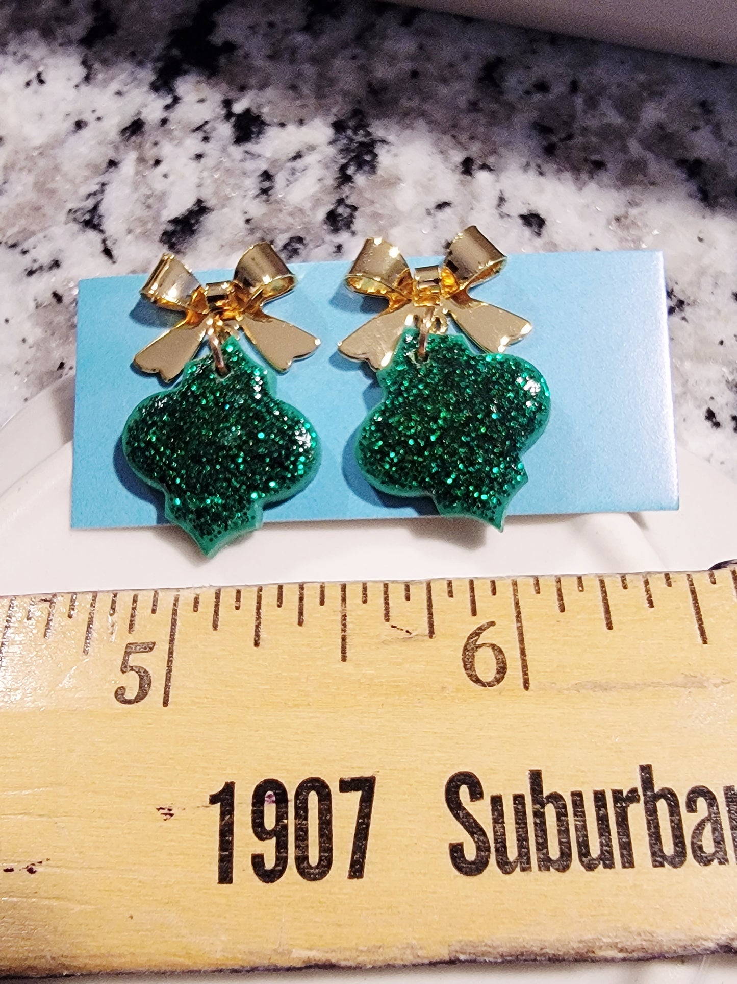 Sparkly green dangles with green bow topper