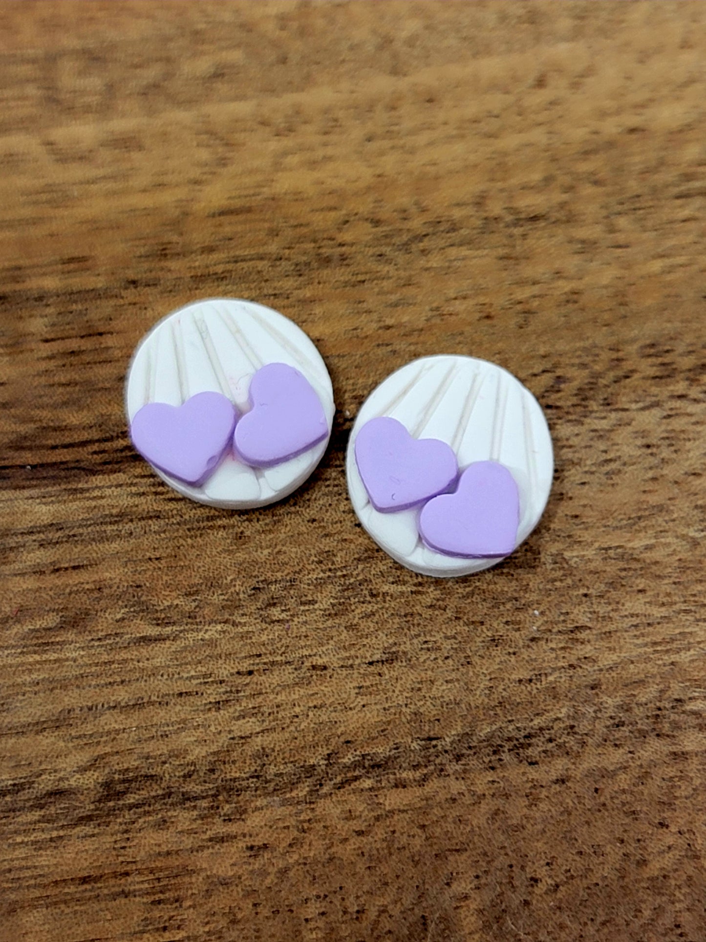 White and purple heart studs