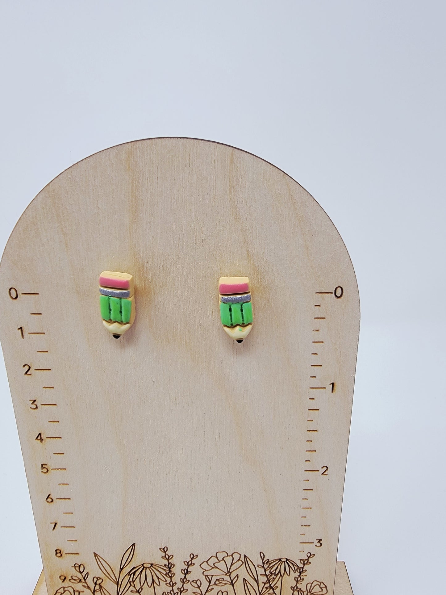 Green pencil studs