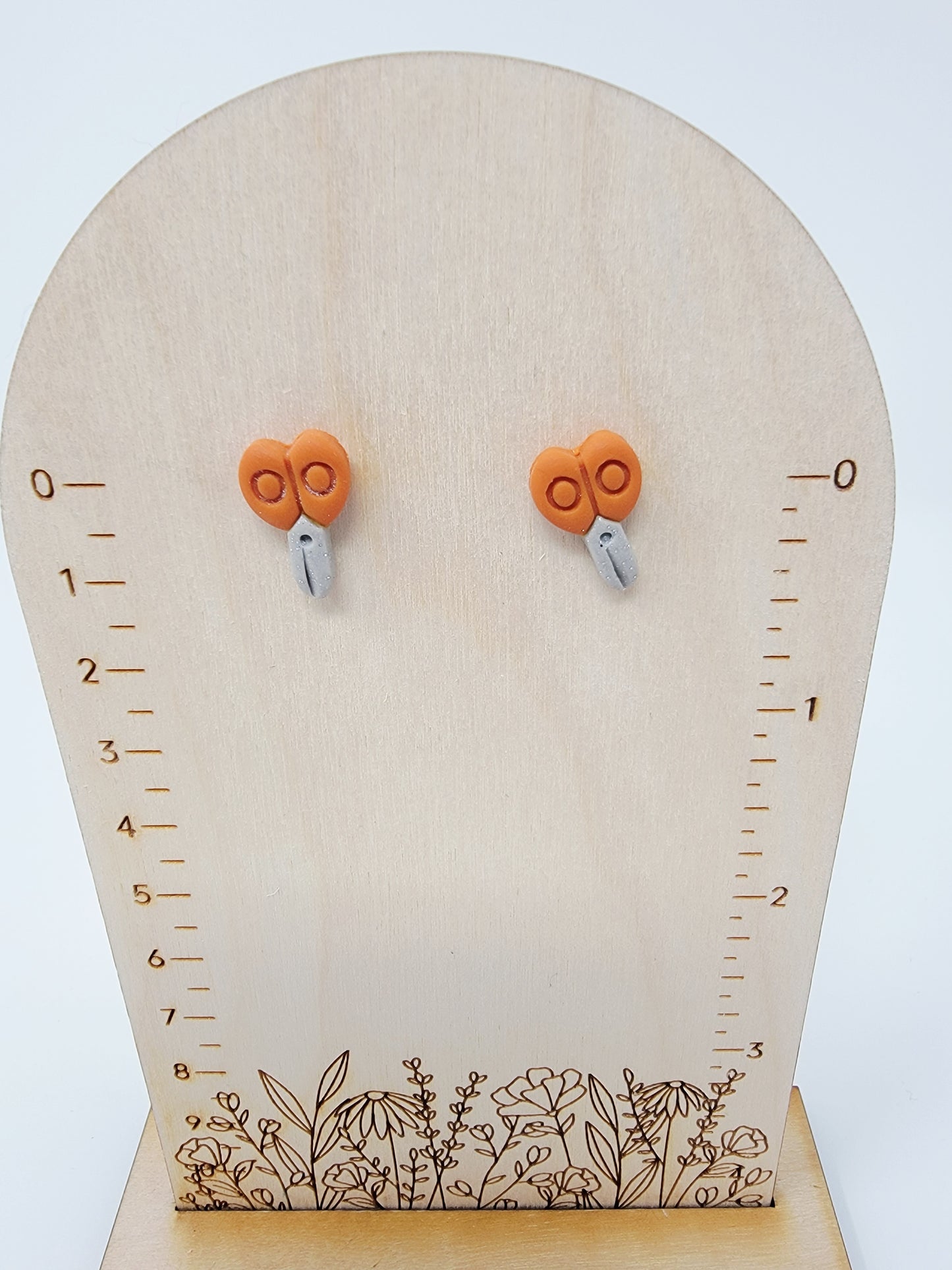 Orange scissor studs
