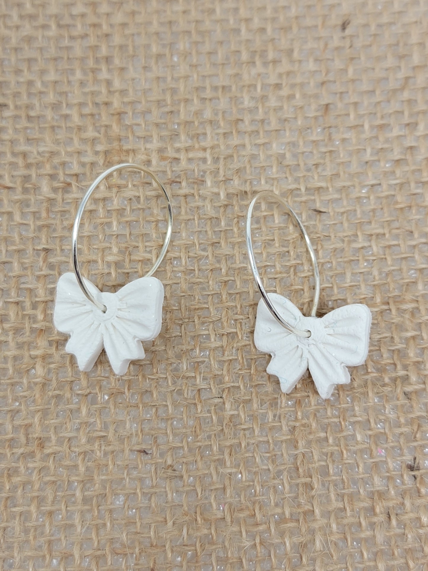 White chunky bow silver hoops