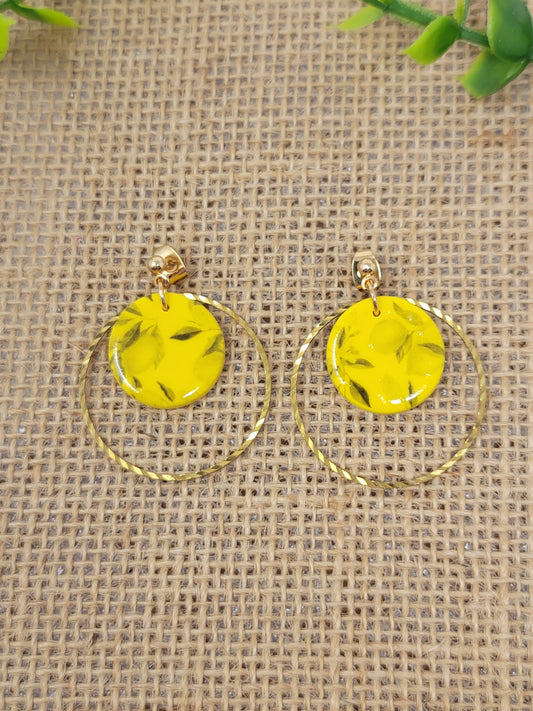 Lemon tree pattern dangles with brass hoop accent