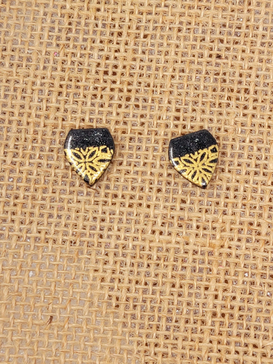 Black and gold studs