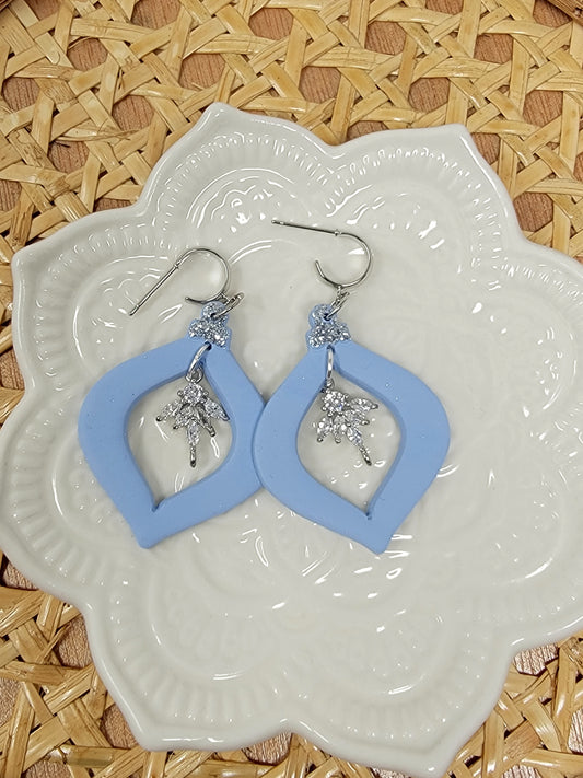 Light blue ornament dangles with cz charm