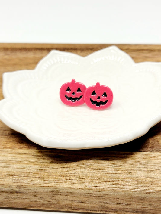 Pink jack o'lantern studs