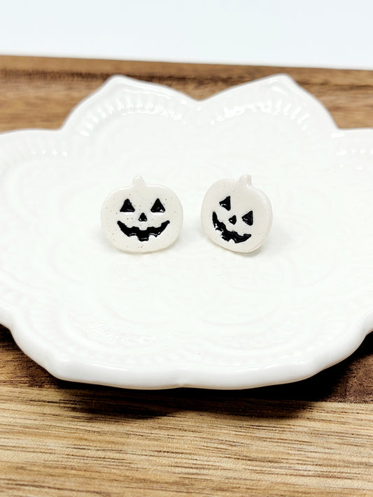 White jack o'lantern studs