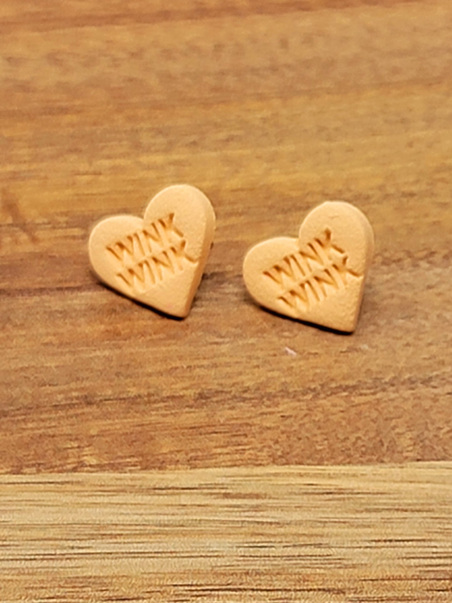 Orange conversation heart studs - wink wink