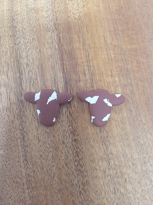 Brown cow studs