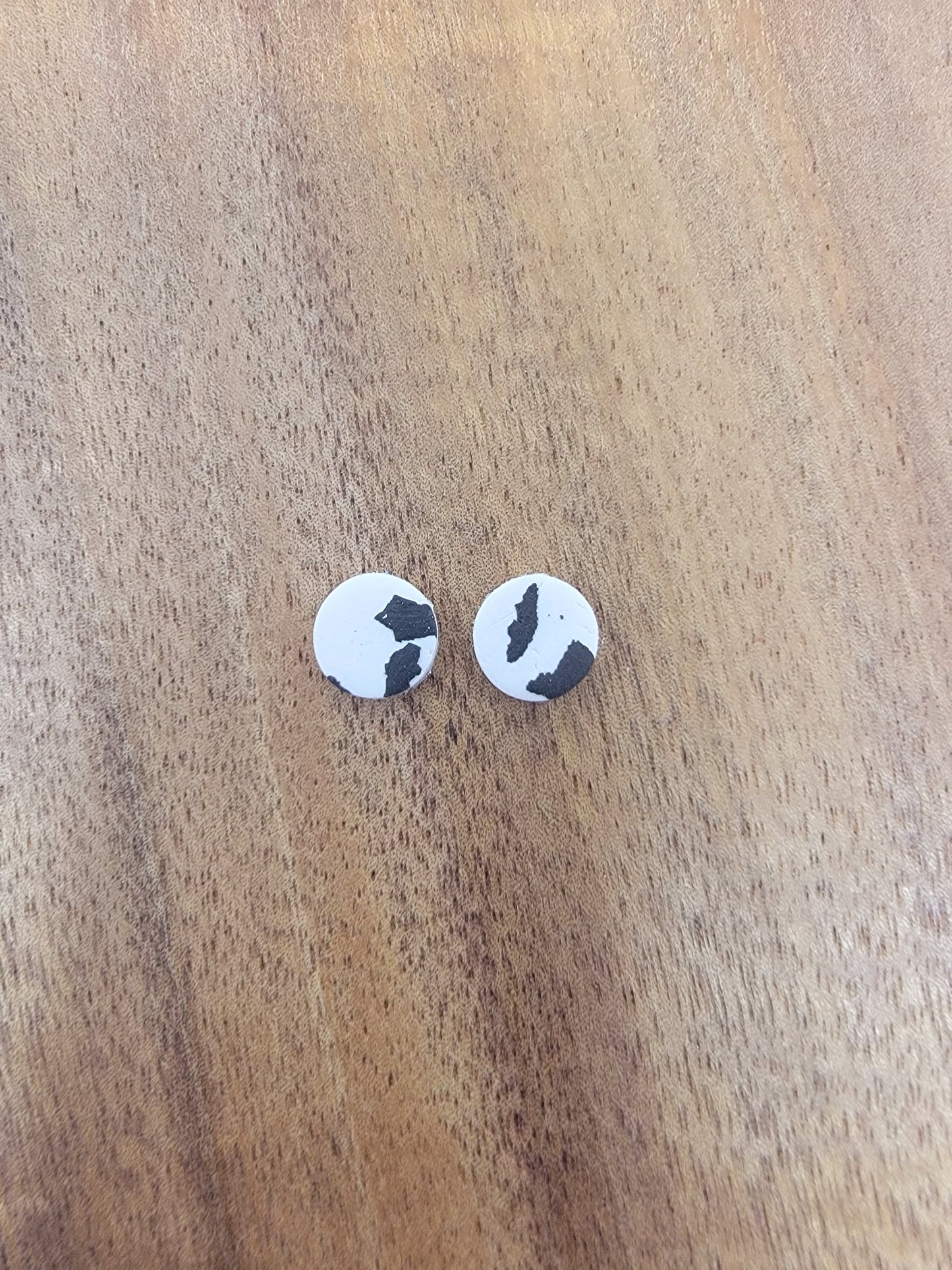 Mini white cow print studs