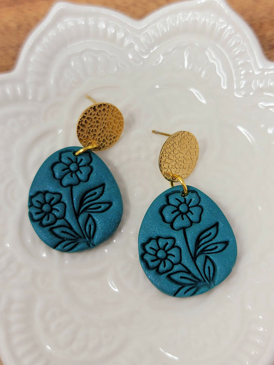 Shimmery dark teal floral dangles