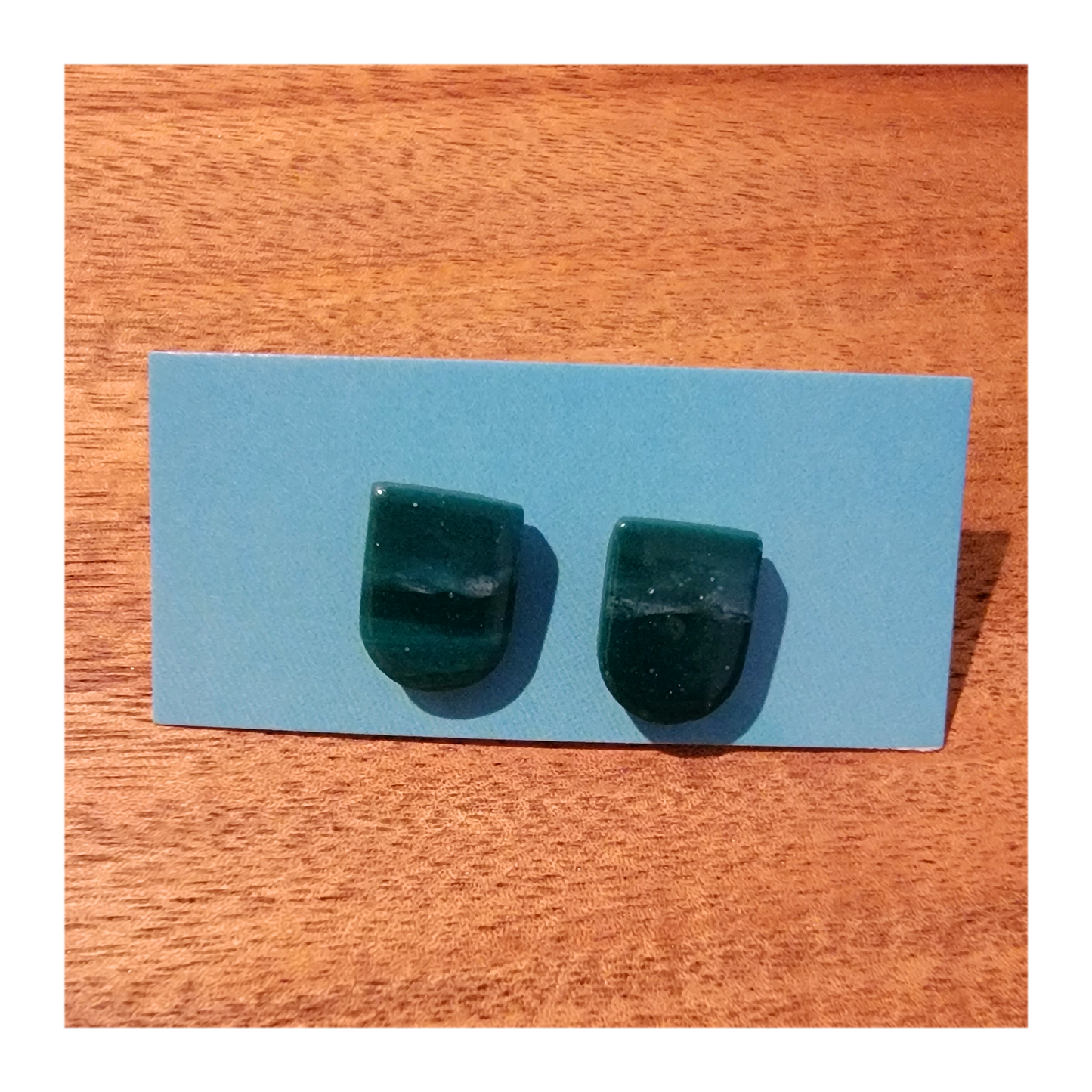 Shimmery green swirly studs