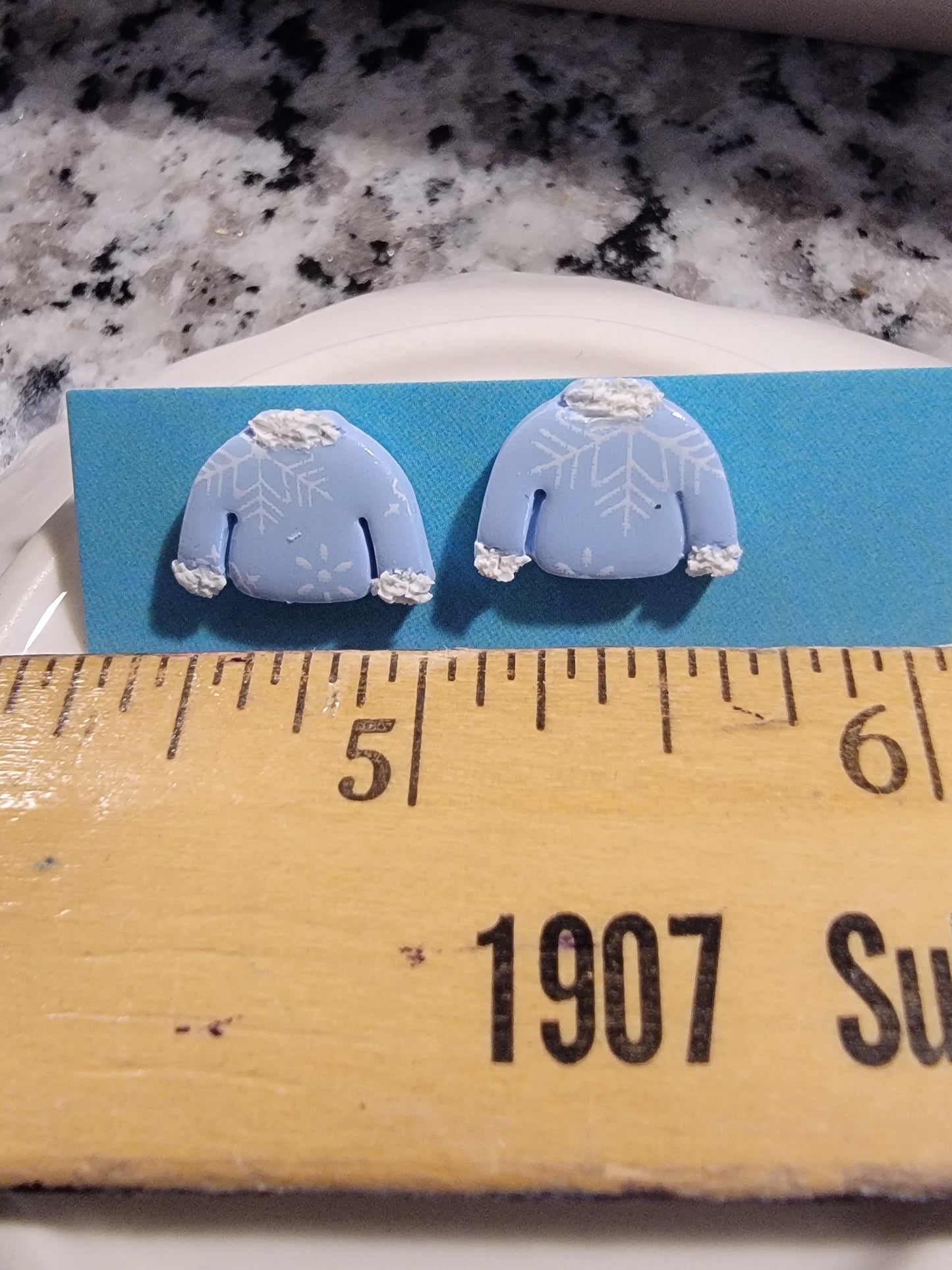 Snowflake sweater studs