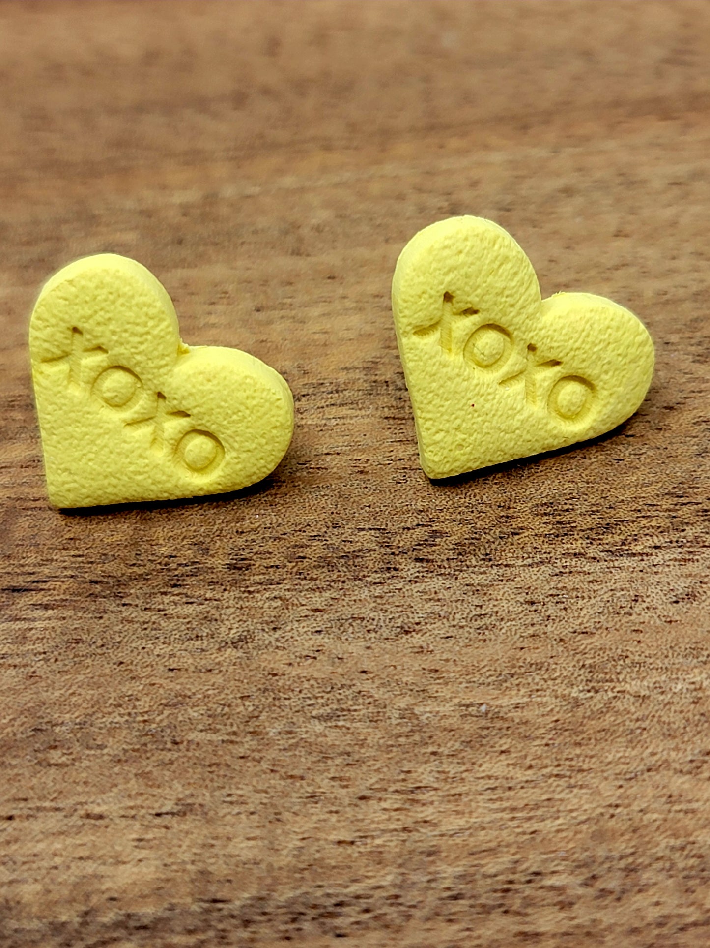 Yellow candy heart studs