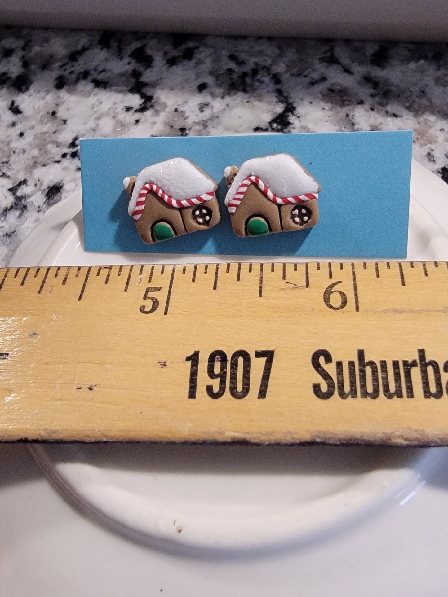 Snowy gingerbread house with green door