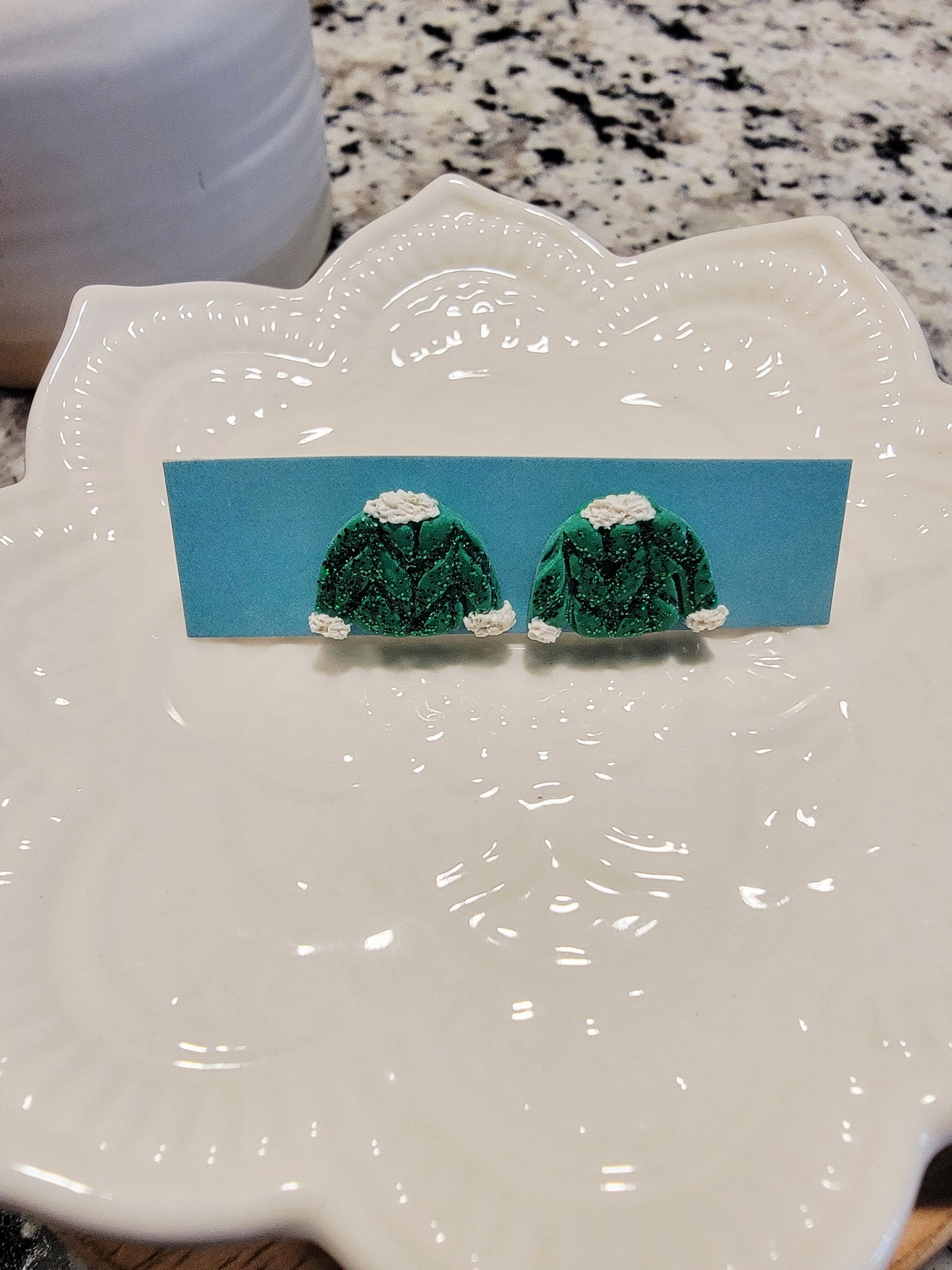 Glittery green sweater studs