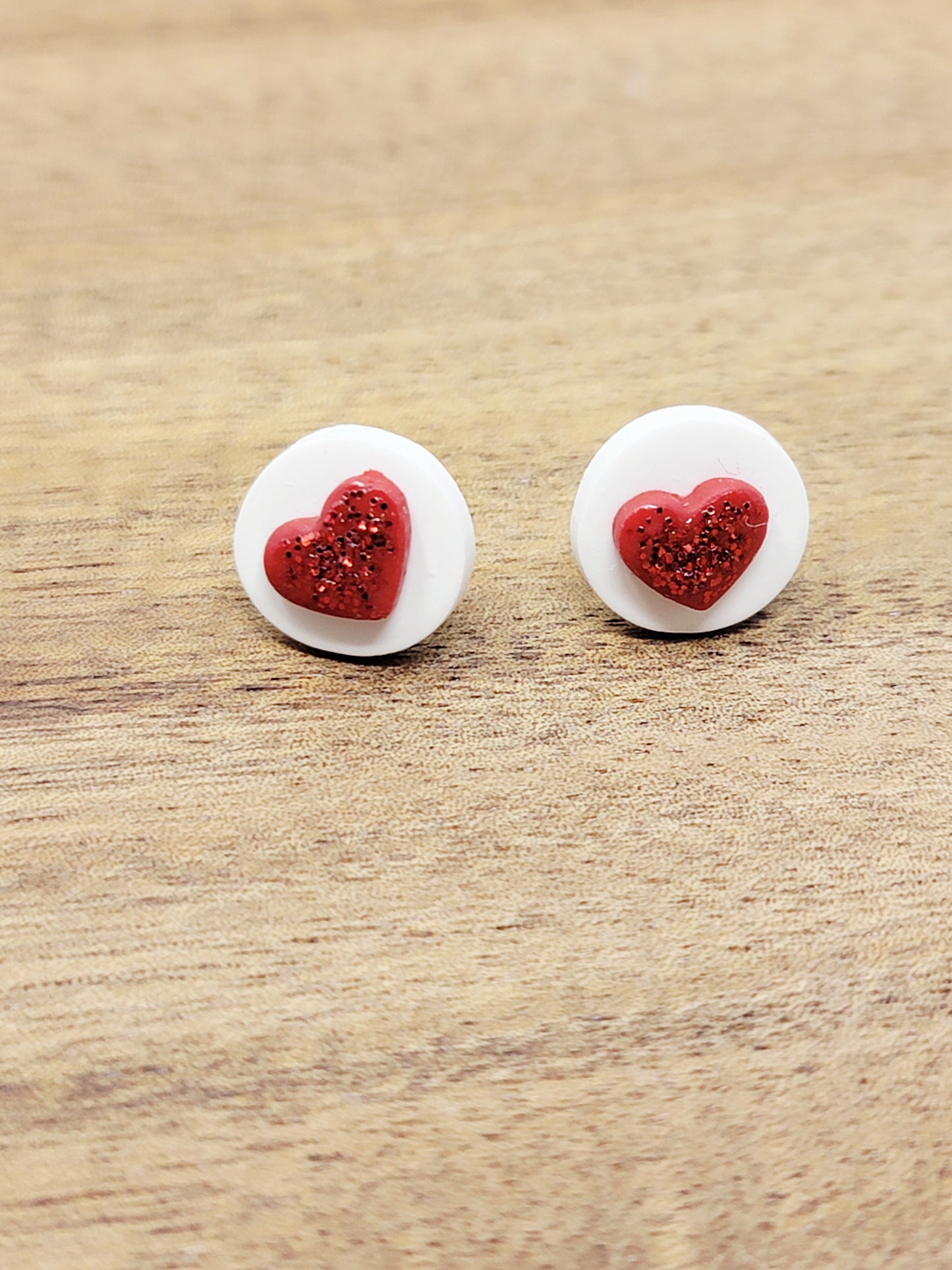 Round white with red heart studs