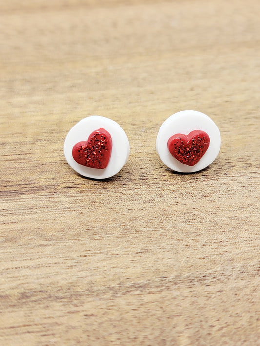 Round white with red heart studs