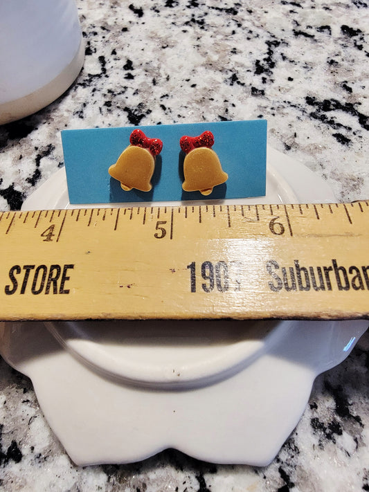 Gold bells with red bow studs.